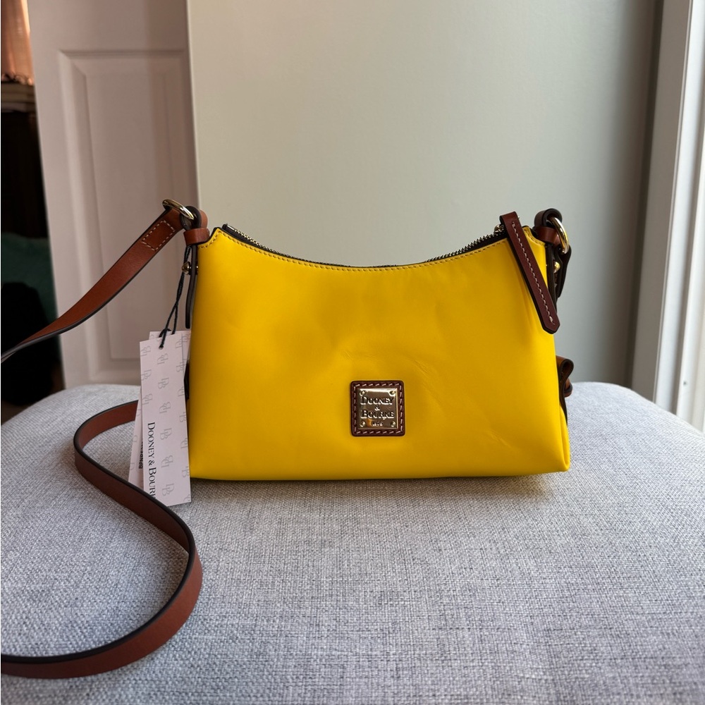 Dooney & Bourke NWT yellow crossbody bag with papers and dust bag